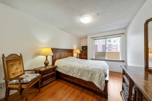 2132-700 Willowbrook Road Nw, Airdrie, AB - Indoor Photo Showing Bedroom