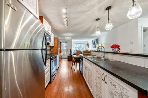 2132-700 Willowbrook Road Nw, Airdrie, AB - Indoor Photo Showing Kitchen With Double Sink