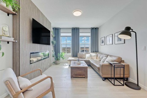 164 Setonstone Manor Se, Calgary, AB - Indoor Photo Showing Living Room With Fireplace