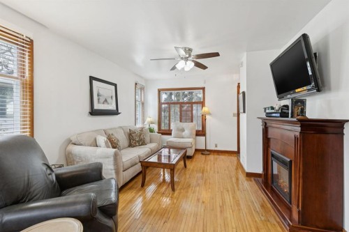 2048 26 Street Se, Calgary, AB - Indoor Photo Showing Living Room With Fireplace