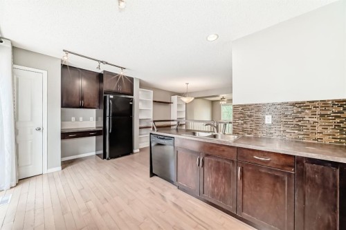 314 New Brighton Villas Se, Calgary, AB - Indoor Photo Showing Kitchen With Double Sink