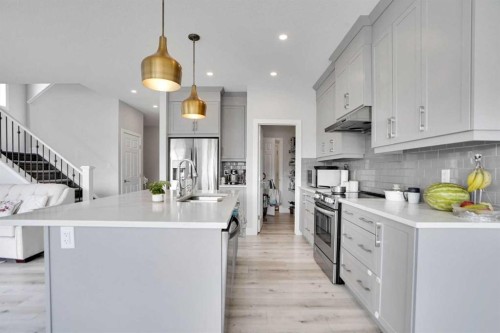 3 Rivercrest Common, Cochrane, AB - Indoor Photo Showing Kitchen With Upgraded Kitchen