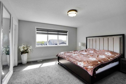 3 Rivercrest Common, Cochrane, AB - Indoor Photo Showing Bedroom