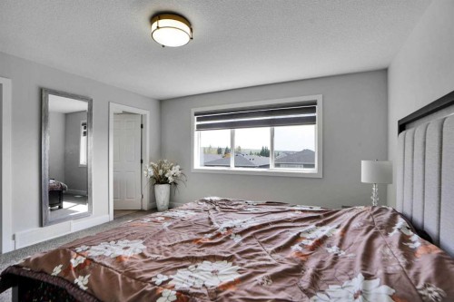 3 Rivercrest Common, Cochrane, AB - Indoor Photo Showing Bedroom