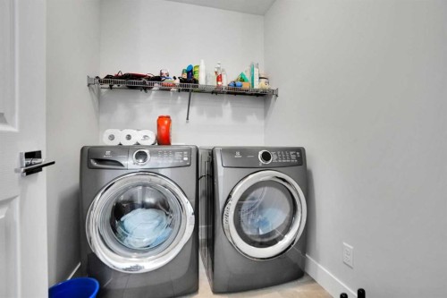 3 Rivercrest Common, Cochrane, AB - Indoor Photo Showing Laundry Room