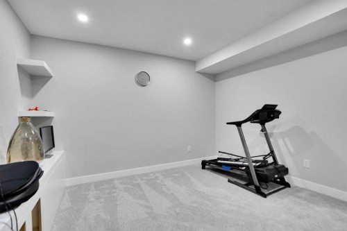 3 Rivercrest Common, Cochrane, AB - Indoor Photo Showing Gym Room