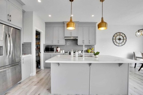 3 Rivercrest Common, Cochrane, AB - Indoor Photo Showing Kitchen With Upgraded Kitchen