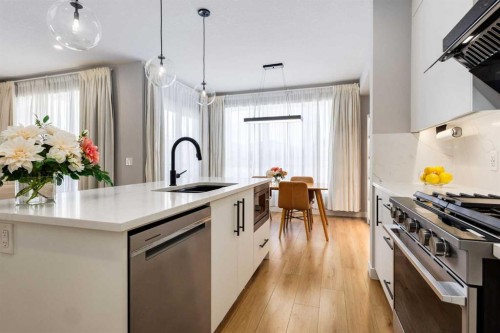 237-7820 Spring Willow Drive Sw, Calgary, AB - Indoor Photo Showing Kitchen With Upgraded Kitchen