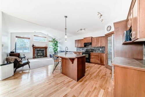 124 Lavender Way, Chestermere, AB - Indoor Photo Showing Kitchen With Fireplace