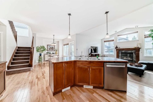 124 Lavender Way, Chestermere, AB - Indoor Photo Showing Kitchen With Fireplace