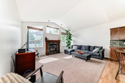 124 Lavender Way, Chestermere, AB - Indoor Photo Showing Living Room With Fireplace
