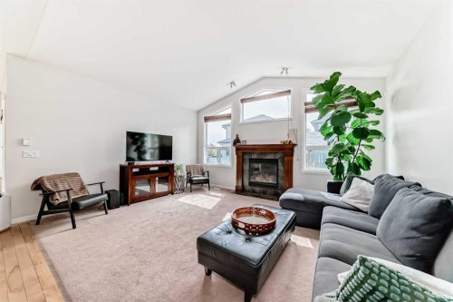 124 Lavender Way, Chestermere, AB - Indoor Photo Showing Living Room With Fireplace