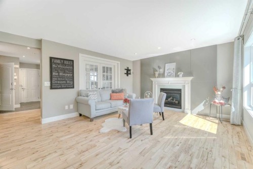 100 Royal Birch Crescent Nw, Calgary, AB - Indoor Photo Showing Living Room With Fireplace