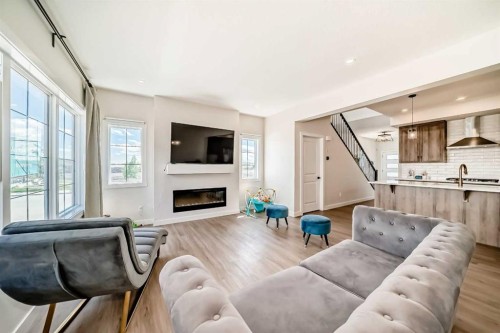 10 Verity Landing Sw, Calgary, AB - Indoor Photo Showing Living Room With Fireplace