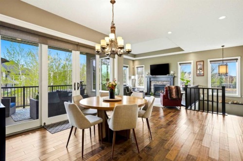 45 Cranbrook Heights Se, Calgary, AB - Indoor Photo Showing Dining Room With Fireplace