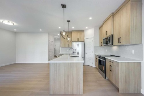 122 Sandpiper Bend, Chestermere, AB - Indoor Photo Showing Kitchen With Upgraded Kitchen