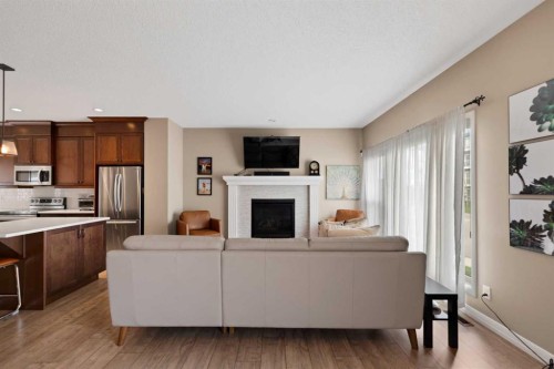 79 Cornerstone Passage Ne, Calgary, AB - Indoor Photo Showing Kitchen With Fireplace