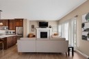 79 Cornerstone Passage Ne, Calgary, AB  - Indoor Photo Showing Kitchen With Fireplace 