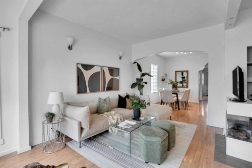 614 19 Avenue Nw, Calgary, AB - Indoor Photo Showing Living Room With Fireplace