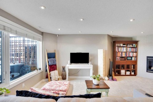 378 Patterson Boulevard Sw, Calgary, AB - Indoor Photo Showing Living Room With Fireplace