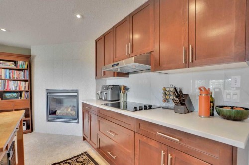378 Patterson Boulevard Sw, Calgary, AB - Indoor Photo Showing Kitchen With Fireplace