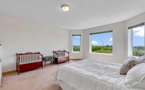9 Panorama Hills Manor Nw, Calgary, AB - Indoor Photo Showing Bedroom