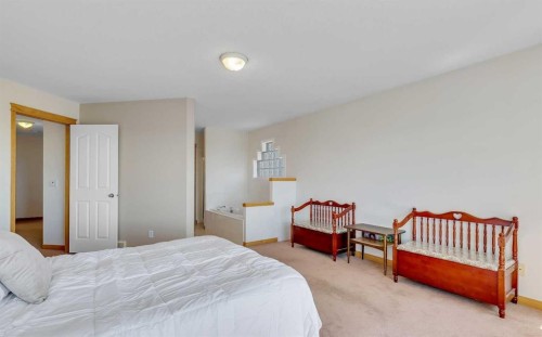 9 Panorama Hills Manor Nw, Calgary, AB - Indoor Photo Showing Bedroom