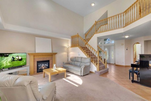 9 Panorama Hills Manor Nw, Calgary, AB - Indoor Photo Showing Living Room With Fireplace