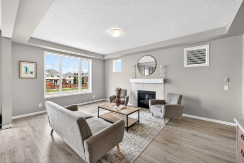 293 Windrow Crescent Sw, Airdrie, AB - Indoor Photo Showing Living Room With Fireplace