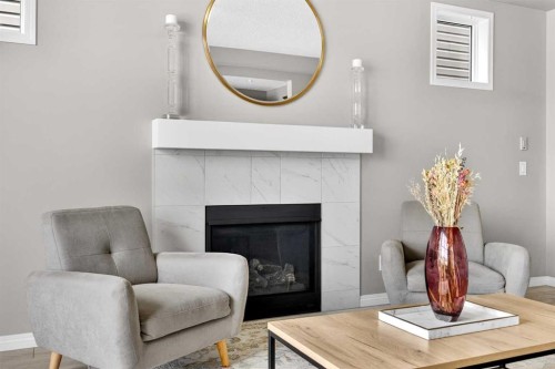 293 Windrow Crescent Sw, Airdrie, AB - Indoor Photo Showing Living Room With Fireplace