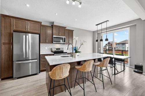 293 Windrow Crescent Sw, Airdrie, AB - Indoor Photo Showing Kitchen With Stainless Steel Kitchen With Double Sink With Upgraded Kitchen