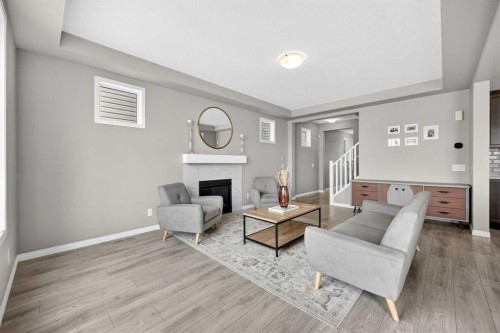 293 Windrow Crescent Sw, Airdrie, AB - Indoor Photo Showing Living Room With Fireplace