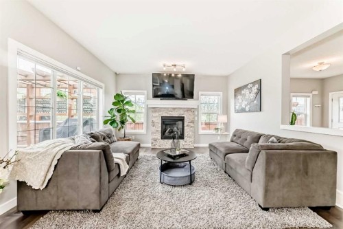 2201 Bayside Circle Sw, Airdrie, AB - Indoor Photo Showing Living Room With Fireplace