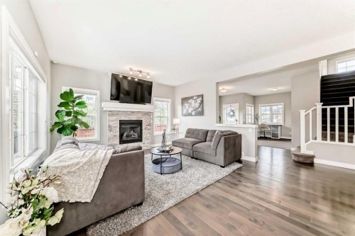 2201 Bayside Circle Sw, Airdrie, AB - Indoor Photo Showing Living Room With Fireplace