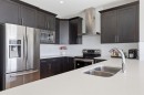 4 Heritage Terrace, Cochrane, AB  - Indoor Photo Showing Kitchen With Stainless Steel Kitchen With Double Sink With Upgraded Kitchen 
