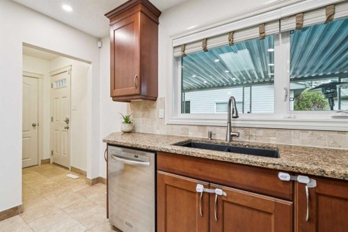 308 99 Avenue Se, Calgary, AB - Indoor Photo Showing Kitchen With Double Sink