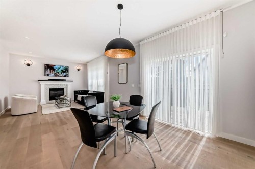420 Legacy View Se, Calgary, AB - Indoor Photo Showing Dining Room With Fireplace