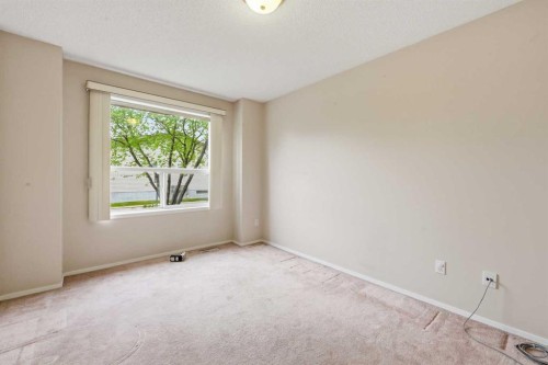 25 Tararidge Circle Ne, Calgary, AB - Indoor Photo Showing Other Room