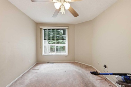 25 Tararidge Circle Ne, Calgary, AB - Indoor Photo Showing Other Room
