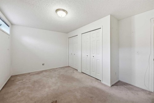 25 Tararidge Circle Ne, Calgary, AB - Indoor Photo Showing Other Room