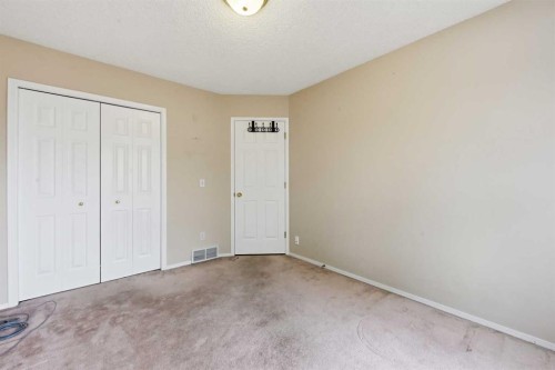 25 Tararidge Circle Ne, Calgary, AB - Indoor Photo Showing Other Room