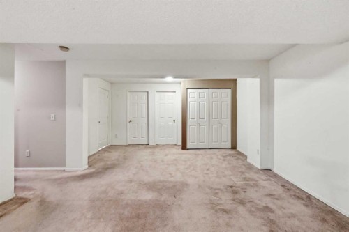 25 Tararidge Circle Ne, Calgary, AB - Indoor Photo Showing Other Room