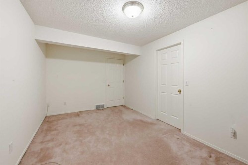 25 Tararidge Circle Ne, Calgary, AB - Indoor Photo Showing Other Room