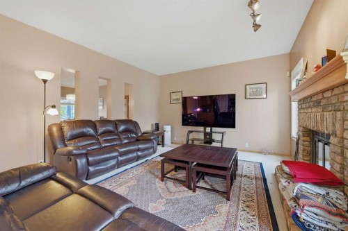 52 Edgebrook Rise Nw, Calgary, AB - Indoor Photo Showing Living Room With Fireplace