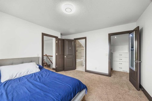 136 Edelweiss Drive Nw, Calgary, AB - Indoor Photo Showing Bedroom