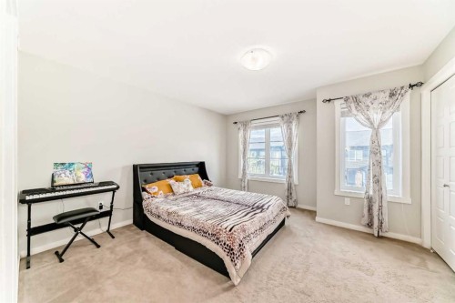 228 Red Embers Way Ne, Calgary, AB - Indoor Photo Showing Bedroom