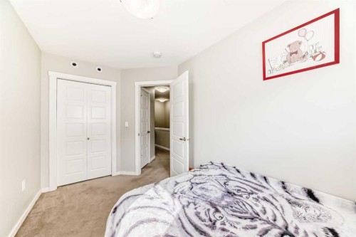 228 Red Embers Way Ne, Calgary, AB - Indoor Photo Showing Bedroom