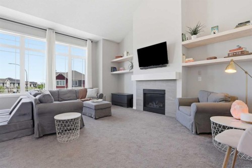 25 Yorkville Green Sw, Calgary, AB - Indoor Photo Showing Living Room With Fireplace