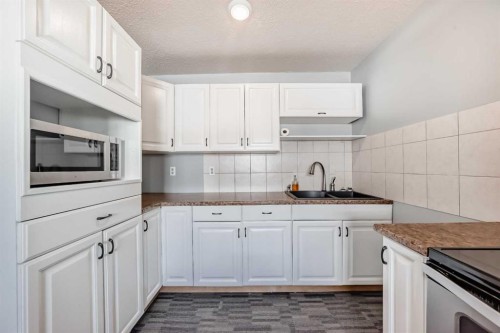 3-4503 75 Street Nw, Calgary, AB - Indoor Photo Showing Kitchen With Double Sink