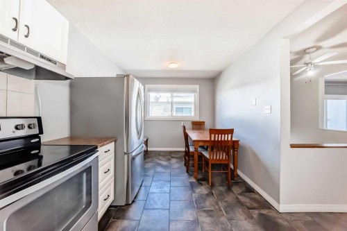 3-4503 75 Street Nw, Calgary, AB - Indoor Photo Showing Kitchen With Stainless Steel Kitchen